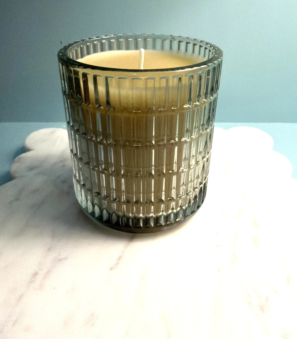 Elegant White Beeswax Candle in Green Glass Vessel