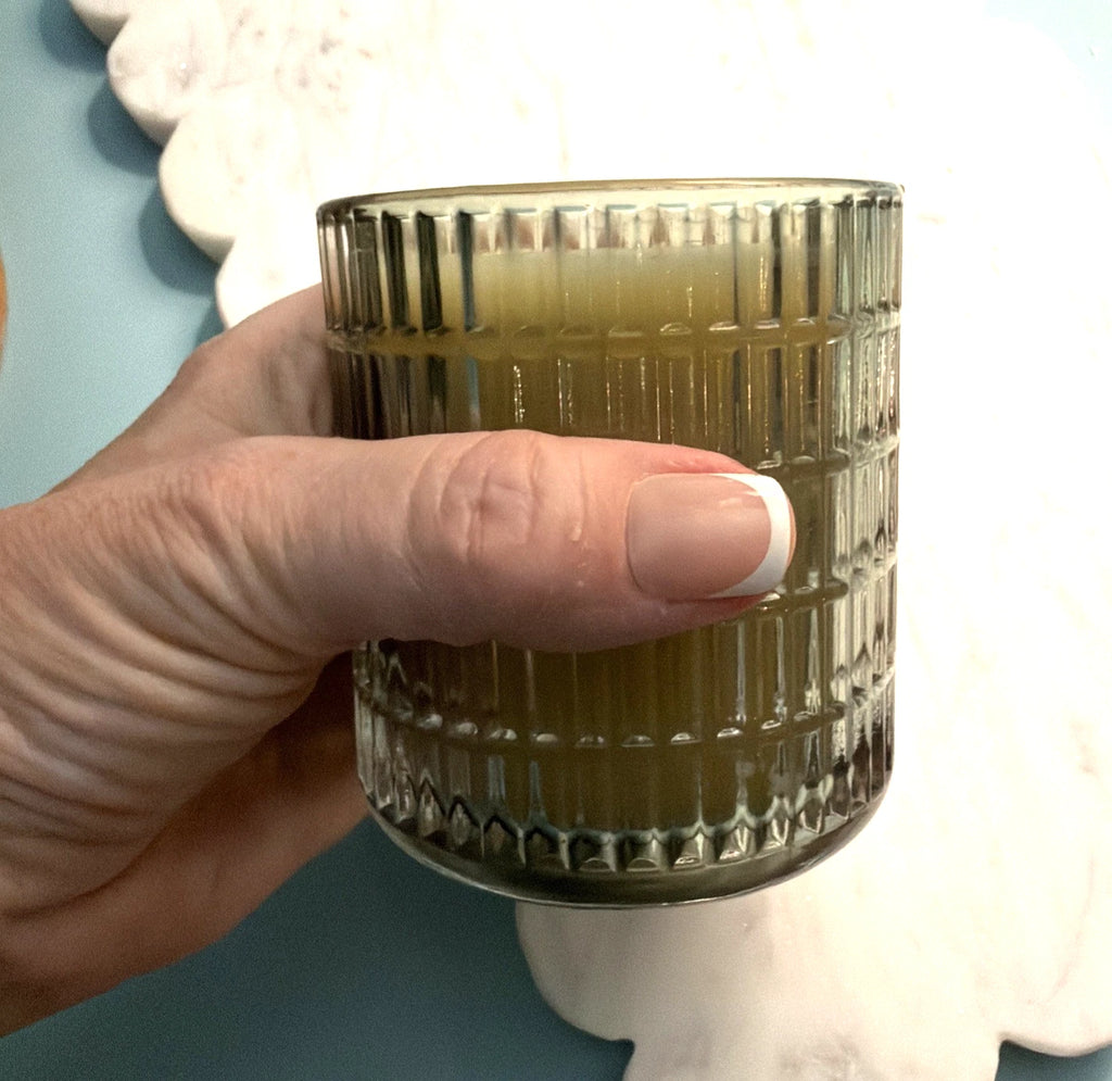 Elegant White Beeswax Candle in Green Glass Vessel