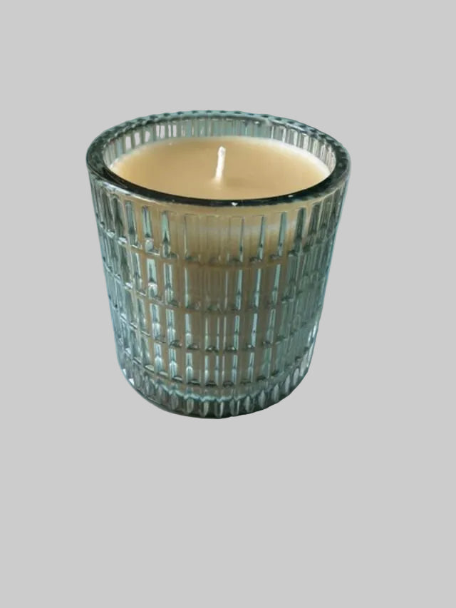 Elegant White Beeswax Candle in Green Glass Vessel