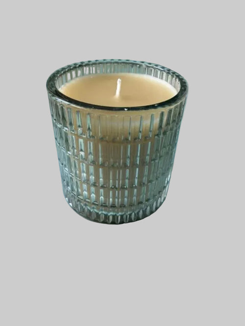 Elegant White Beeswax Candle in Green Glass Vessel